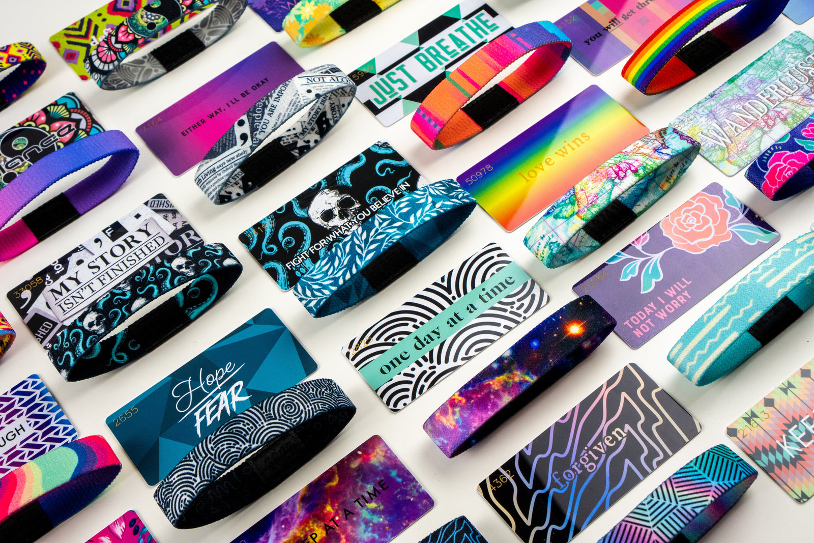 a variety of different zox and their collector cards laid out for a photo, all going diagonal 