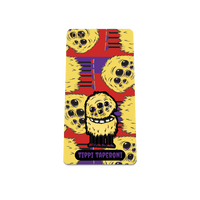 Product photo of the front of the collector’s of 2021 - Day 12 - Tippi Taperoni: Red and purple background with repeating yellow, furry monsters with multiple eyes and 6 legs with purple and red shoes. Purple 'TIPPI TAPERONI' text