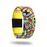 Adventure-Sold Out-ZOX - This item is sold out and will not be restocked. Brightly colored abstract designs with black Xs all over. The inside is yellow and says Adventure. 