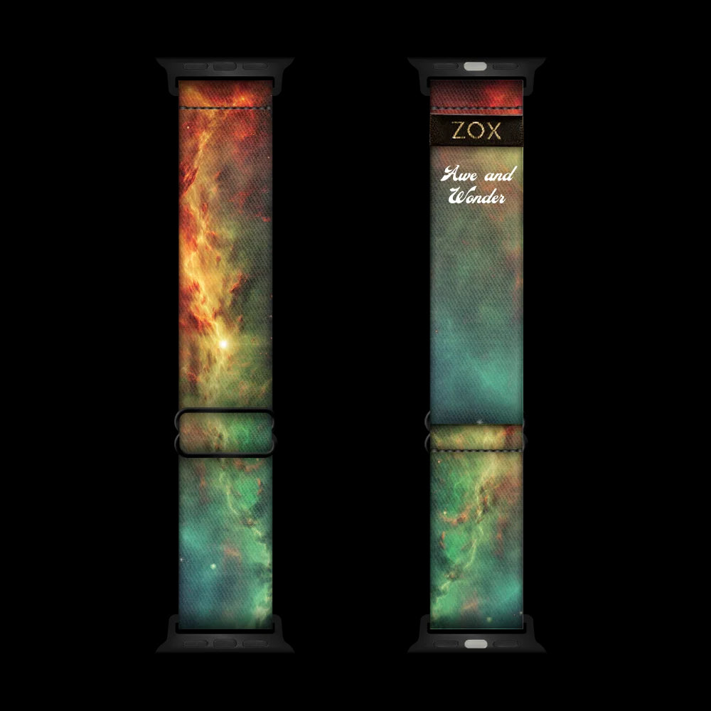 This is a watchband with green, orange and yellow design that looks like a space nebula. The design is the same on the inside and says Awe & Wonder. 