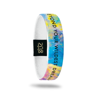 Inside Design of Beyond Your Wildest Dreams: multi-colored galaxy design with black text overlaying ‘Beyond Your Wildest Dreams’