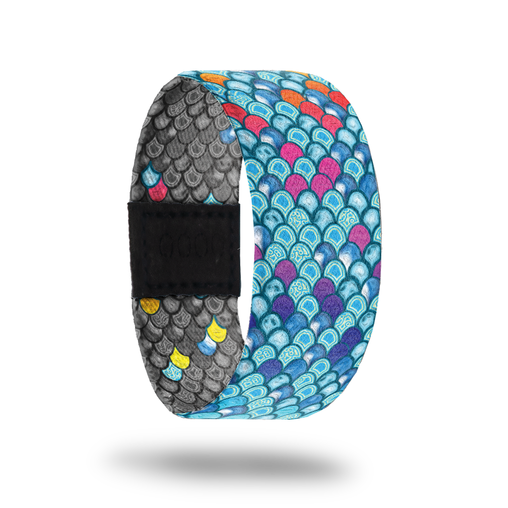 Be Kind-Sold Out-ZOX - This item is sold out and will not be restocked. Bright blue scales of a mermaid with random pink and orange ones. Inside is all gray scales with random colored ones and says Be Kind. 