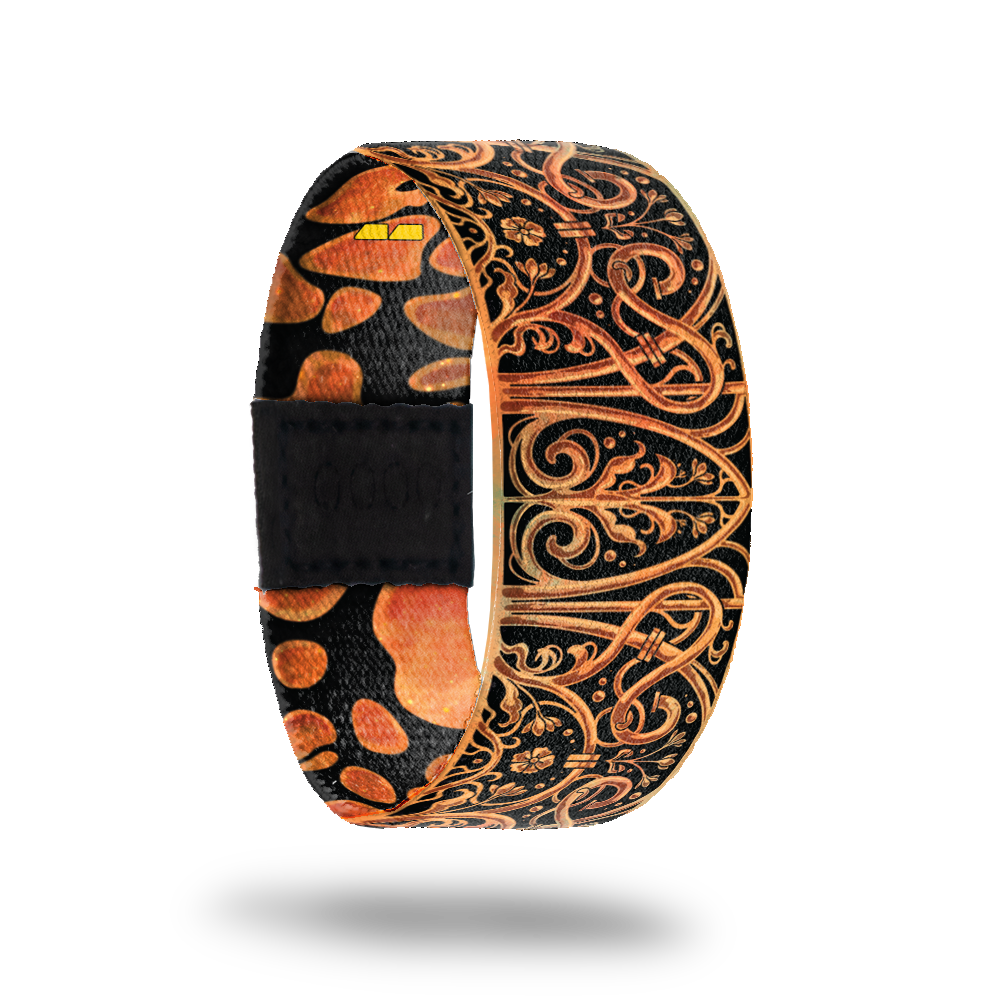 This is a reward item and not purchasble. The design is burnt orange and black with an ornate iron looking deign. The inside is the same and reads Cross The Threshold. 