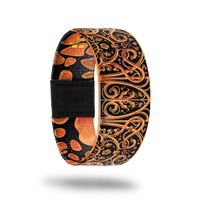 This is a reward item and not purchasble. The design is burnt orange and black with an ornate iron looking deign. The inside is the same and reads Cross The Threshold. 