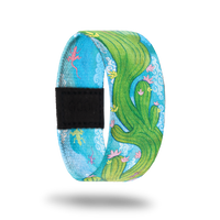Outside Design of Endurance: light blue sky background with green cactus with pick and yellow flowers waving through the center of the strap