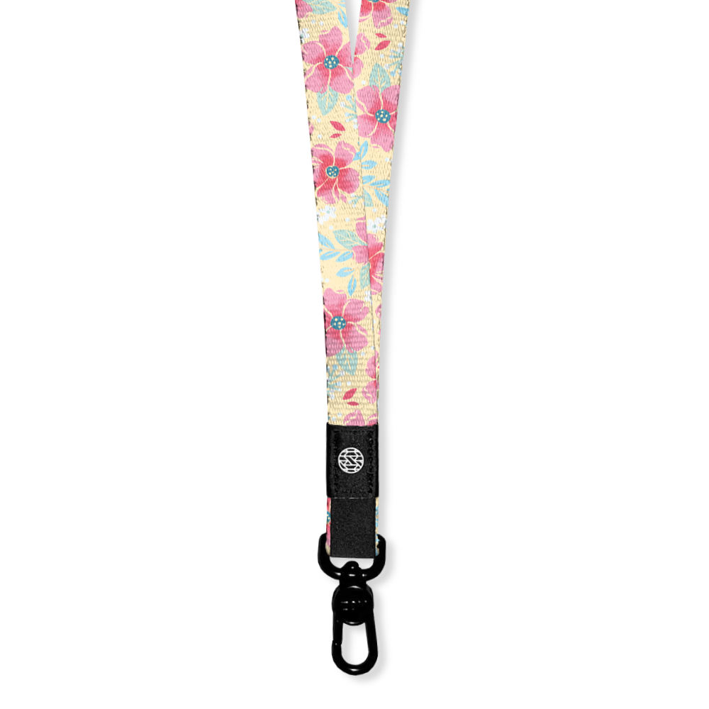 Lanyard with pale yellow base and pink flowers all over. The Inside says I Choose Joy and the lanyard has a metal clip for keys/cards. Each lanyard comes with 2 clips if you need to make a breakaway lanyard. 
