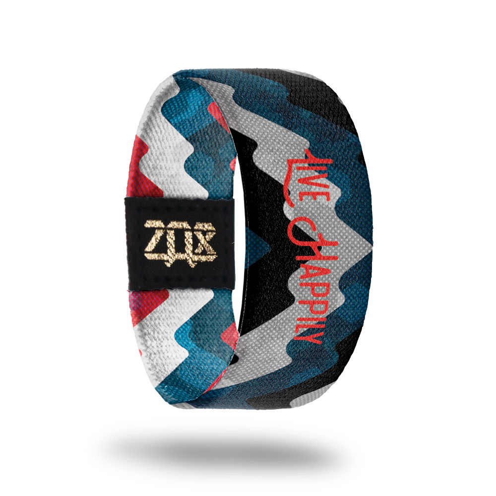 Inside design of Live Happily. Thick wave lines across the strap in dark blue, grey, and dark navy blue. Centered is Live Happily in thin red text