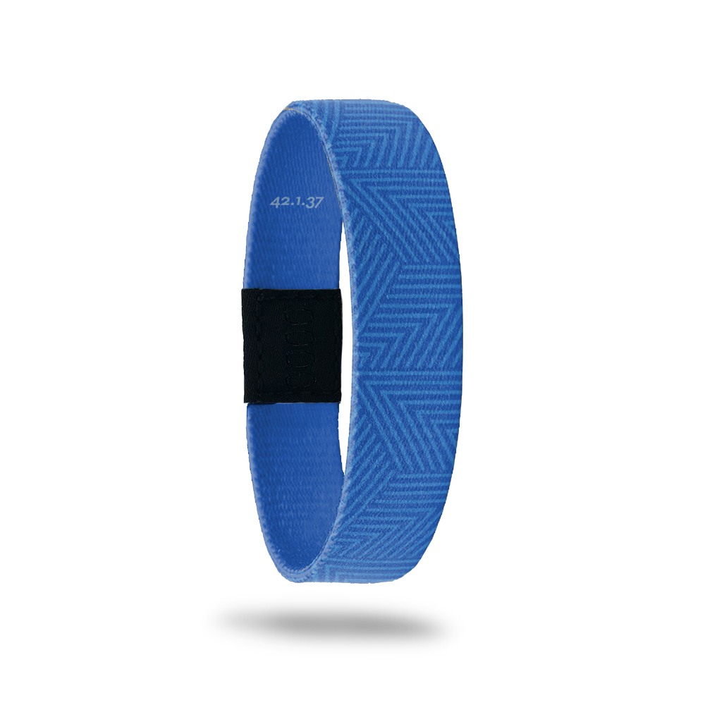 Wristband single in medium blue color whit a lighter blue abstract line design on top. The inside is all blue and reads Nothing Is Impossible. It also lists Bible vers 42.1.37.