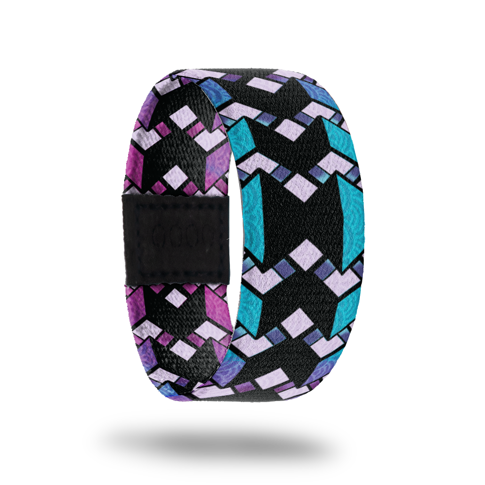 Between The Lines-Sold Out-ZOX - This item is sold out and will not be restocked. Solid black line in the middle with blue thin lines on the outside. Over top is zig zag purple designs. Inside is the same design but is purple and reads Between The Lines. 