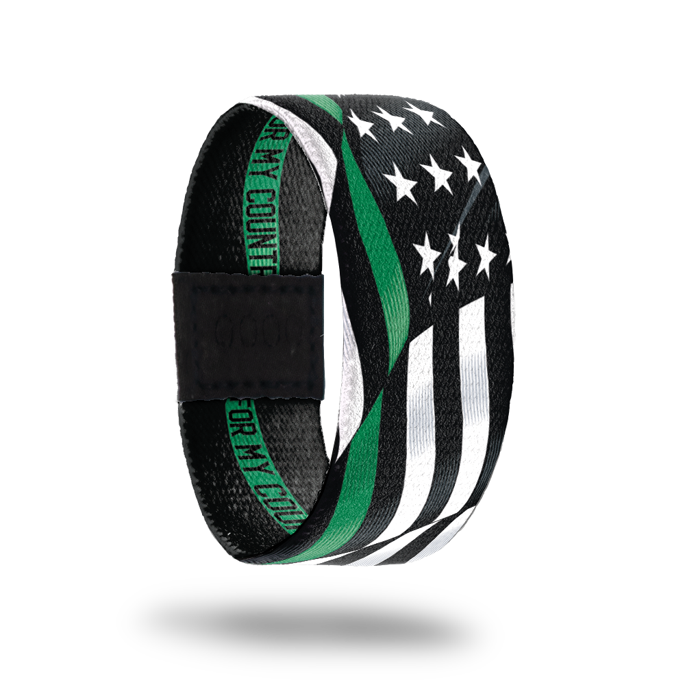 Outside Design of For My Country. wavy black and white United States flag with a line of green for one bottom stripe of the flag