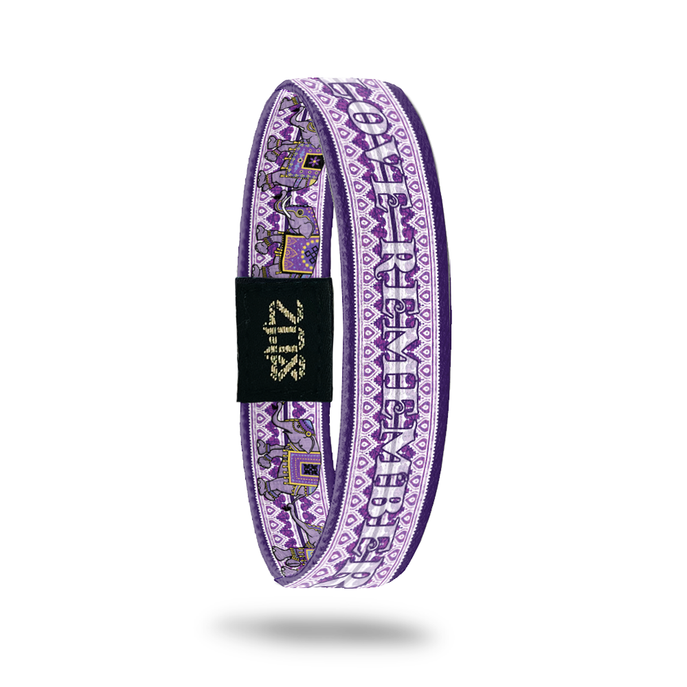 Product photo of the inside of Love Remembers. It is mainly purple to show we're fighting against Alzheimer's. The name Love Remembers is shown and there's a geometric background that is purple