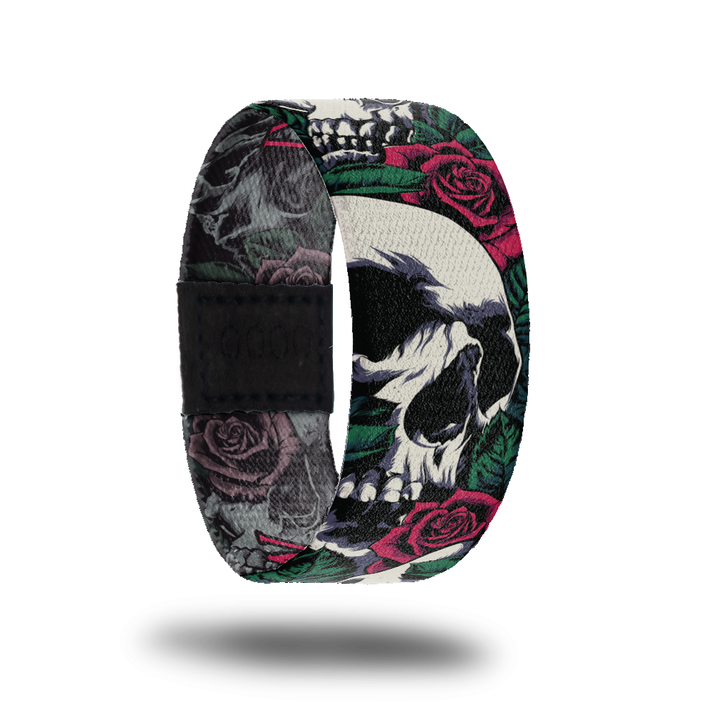 Outside design for Memento Mori. Illustrated realistic white skulls with red roses and green leafs