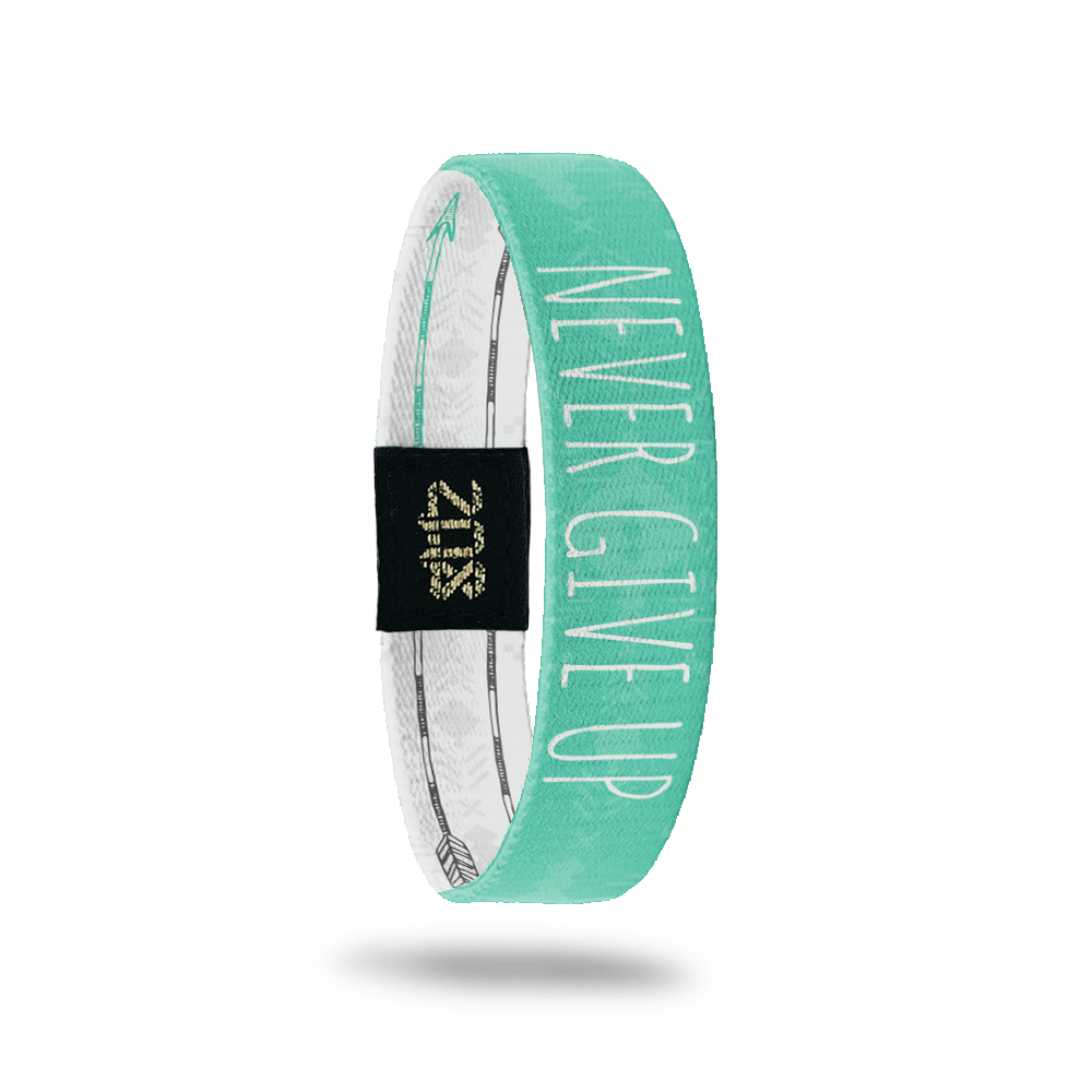 Inside Design of Never Give Up: turquoise and light turquoise tribal design with white text overlaying ‘Never Give Up’