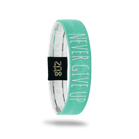 Inside Design of Never Give Up: turquoise and light turquoise tribal design with white text overlaying ‘Never Give Up’