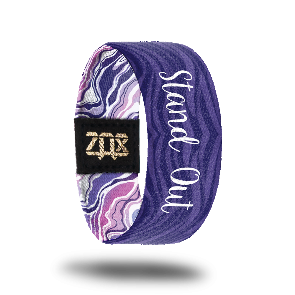 Inside design for Stand Out. Wavy striped background of dark and light purple and centered is Stand Out in white text
