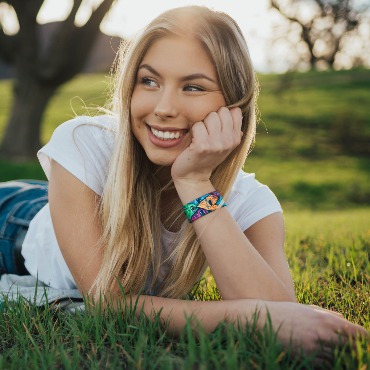 Lifestyle image of a Stay Weird on wrist of smiling model