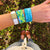 Lifestyle photo of girls wrist with two Endurance straps on showing the inside and outside design of Endurance