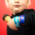 Studio photo of two Ice Cream Float straps on young boys wrist while he is holding an ice cream cone