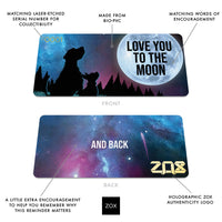 Front and back of Love You To The Moon collector's card showing details of the ZOX collector’s card: matching laser-etched serial number for collectibility, made from bio-pvc, matching words for encouragement, a little extra encouragement on the back to help you remember why this reminder matters, holographic ZOX authenticity logo