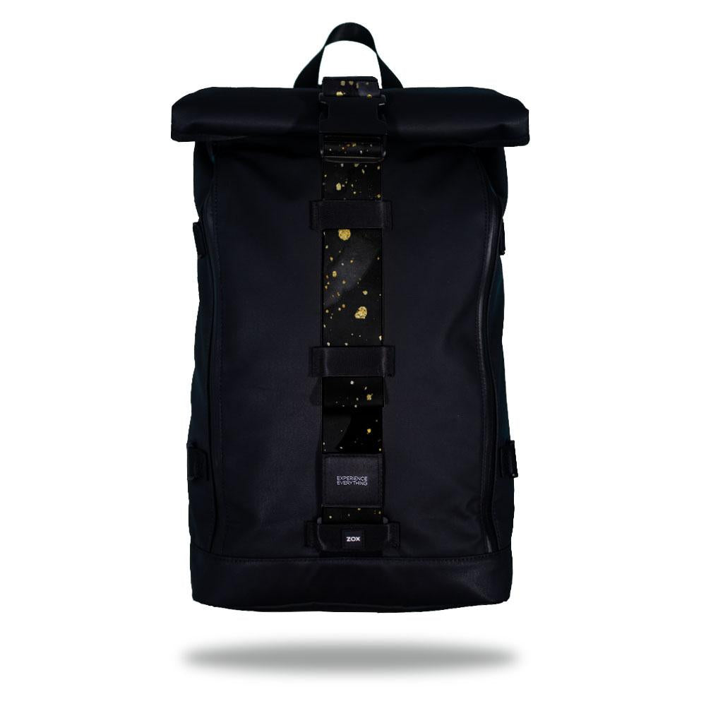 Product image of an Imperial backpack showing a wide strap down the center of it that is interchangeable. The closure strap the item that is for sale on this page and is called Midas and as a black and grey background with little gold speckles on top of it.