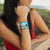 Lifestyle photo of girl wearing two A Better Life wristbands