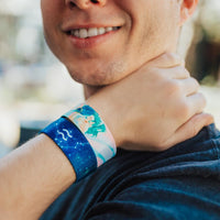 Lifestyle close up image of model's wrist wearing 2 Aquarius straps