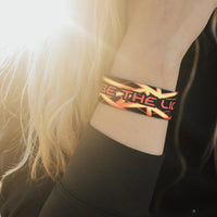 Lifestyle close up image of Be The Light on someone's wrist