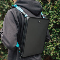 Lifestyle image of a man wearing a document holder with two shoulder straps connected to it