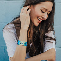 Lifestyle image of women fixing their hair with a Go With The Flow on their wrist