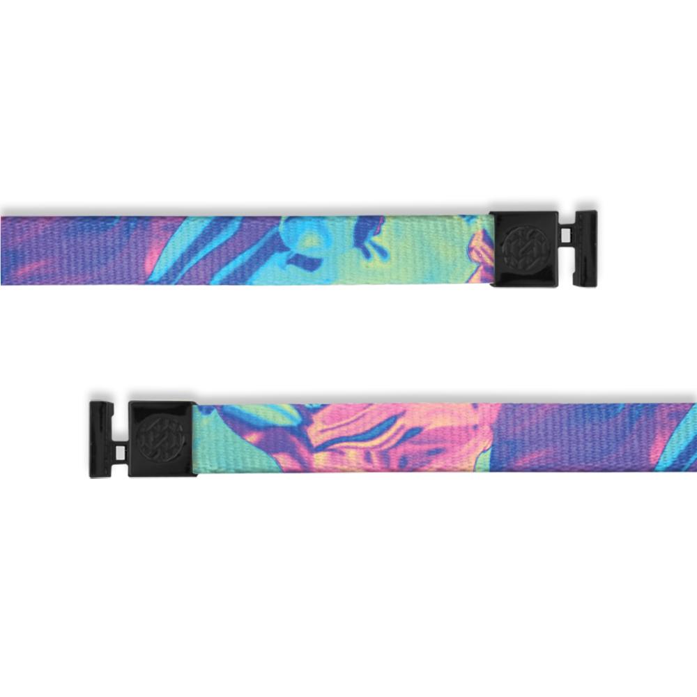 A product image of a wide and flat string with black metal aglets meant to be used with the ZOX hoodie. The string is called Now Or Never the design is a sort of paint swirl and includes colors such as purple, blue, green, and pink