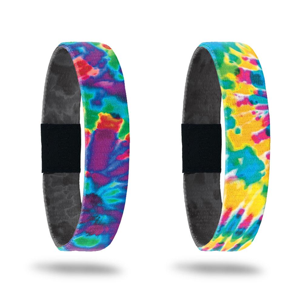 Product photo of the peace single with a purple, blue, green, and red tie dye outside design and the happiness single with a yellow, blue, orange, pink, and green tie dye outside design