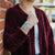 Lifestyle photo of girl holding onto sweater wearing two The Places You'll Go straps showing the inside and outside design