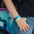 Lifestyle image of someone's hand in pocket wearing You Are Perfect For Something and another Zox wristband