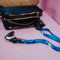 Lifestyle image of Starry Night Lanyard clipped to keys next to someone's purse