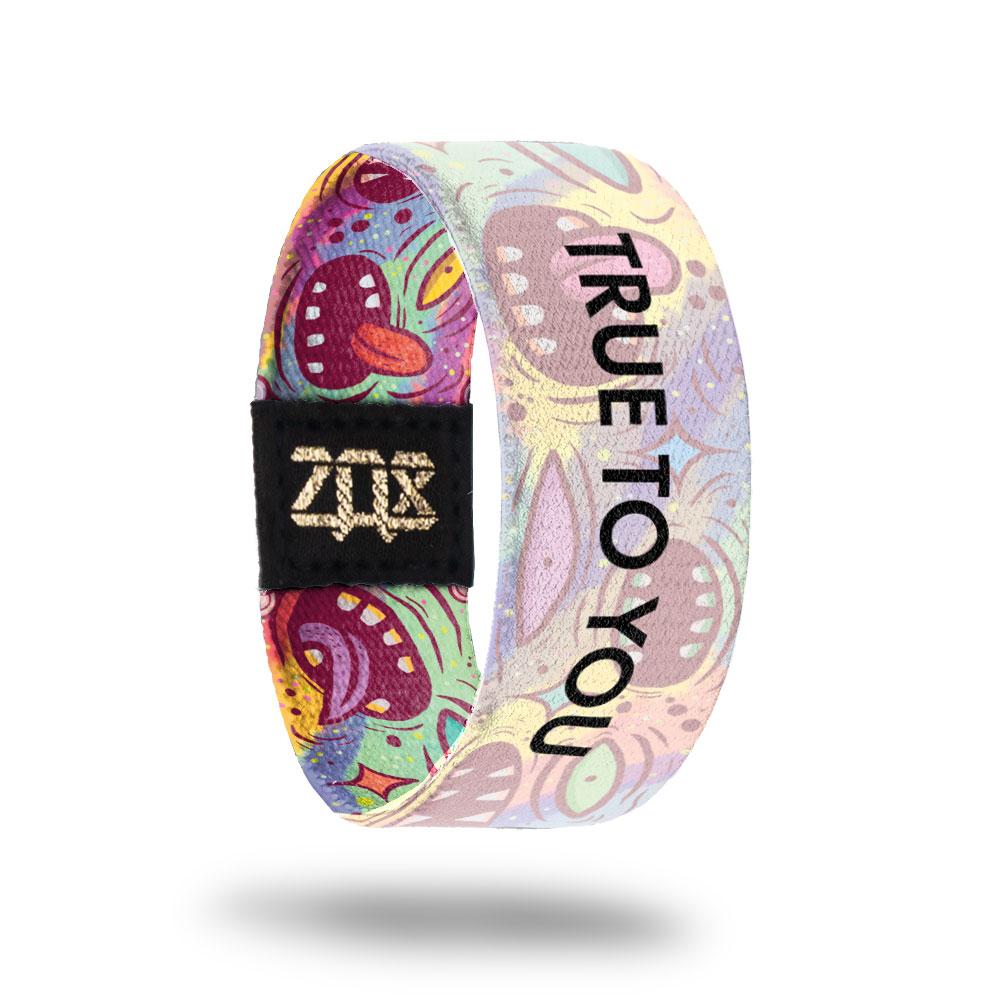 Inside design for True To You. Colorful background with animated drawn mouths and eyes spread along the design with a fog white layer over it. Centered is True To You in black text